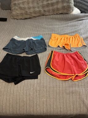 Nike women running shorts bundle of 4 in size Large